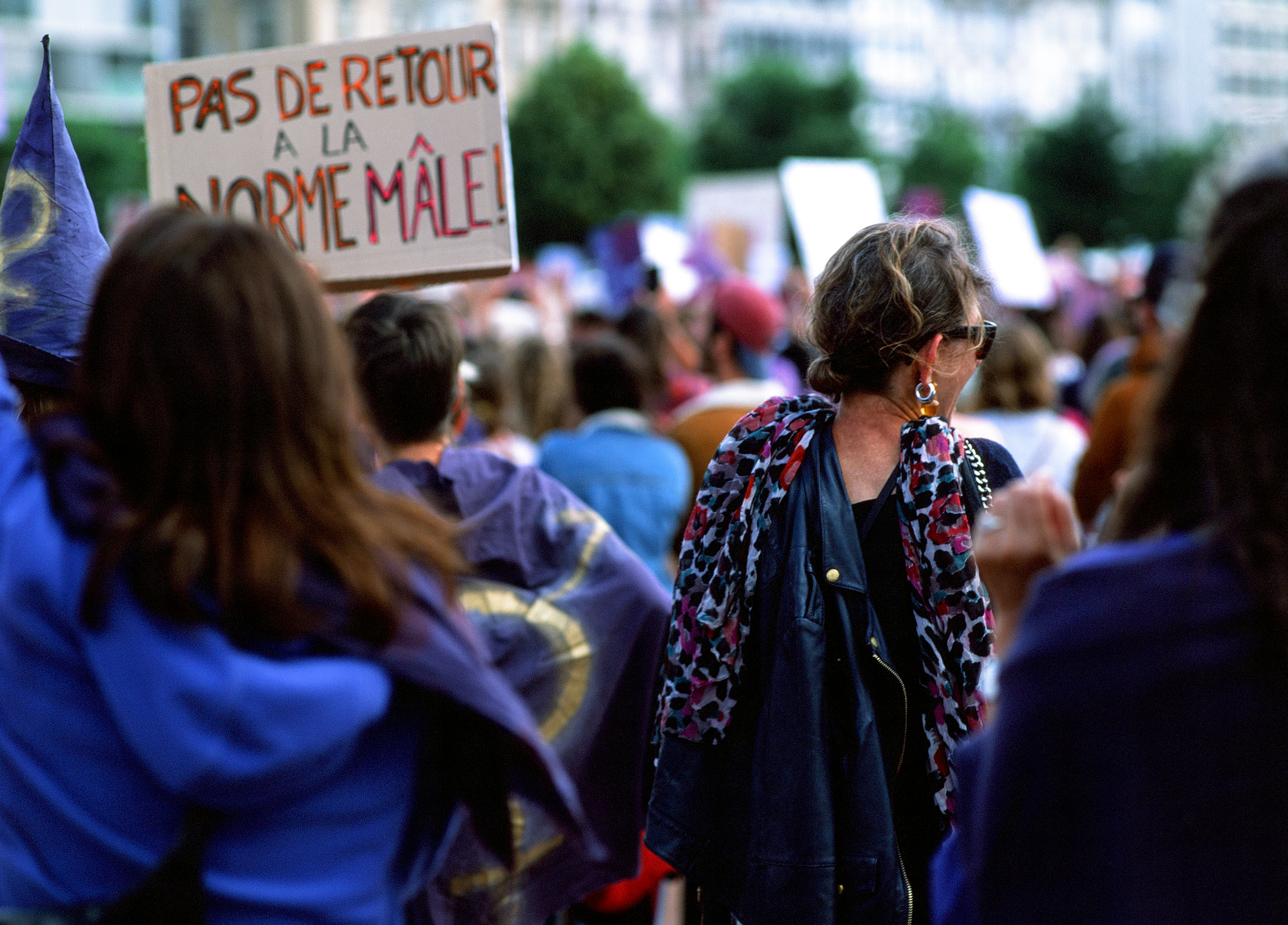 Group of swiss feminist women protest. Blue and purple colors